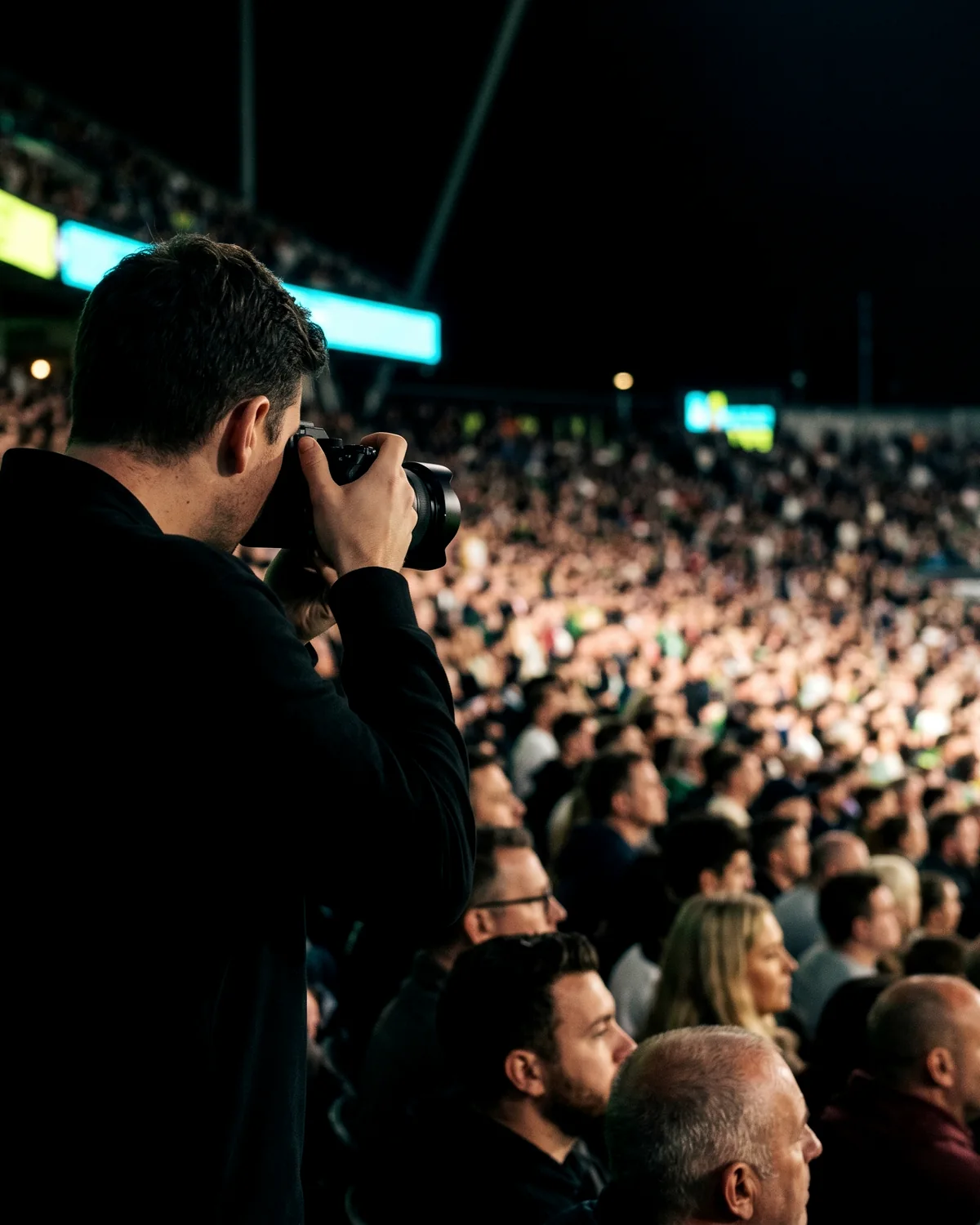 Pro photographer working the crowd at a night event