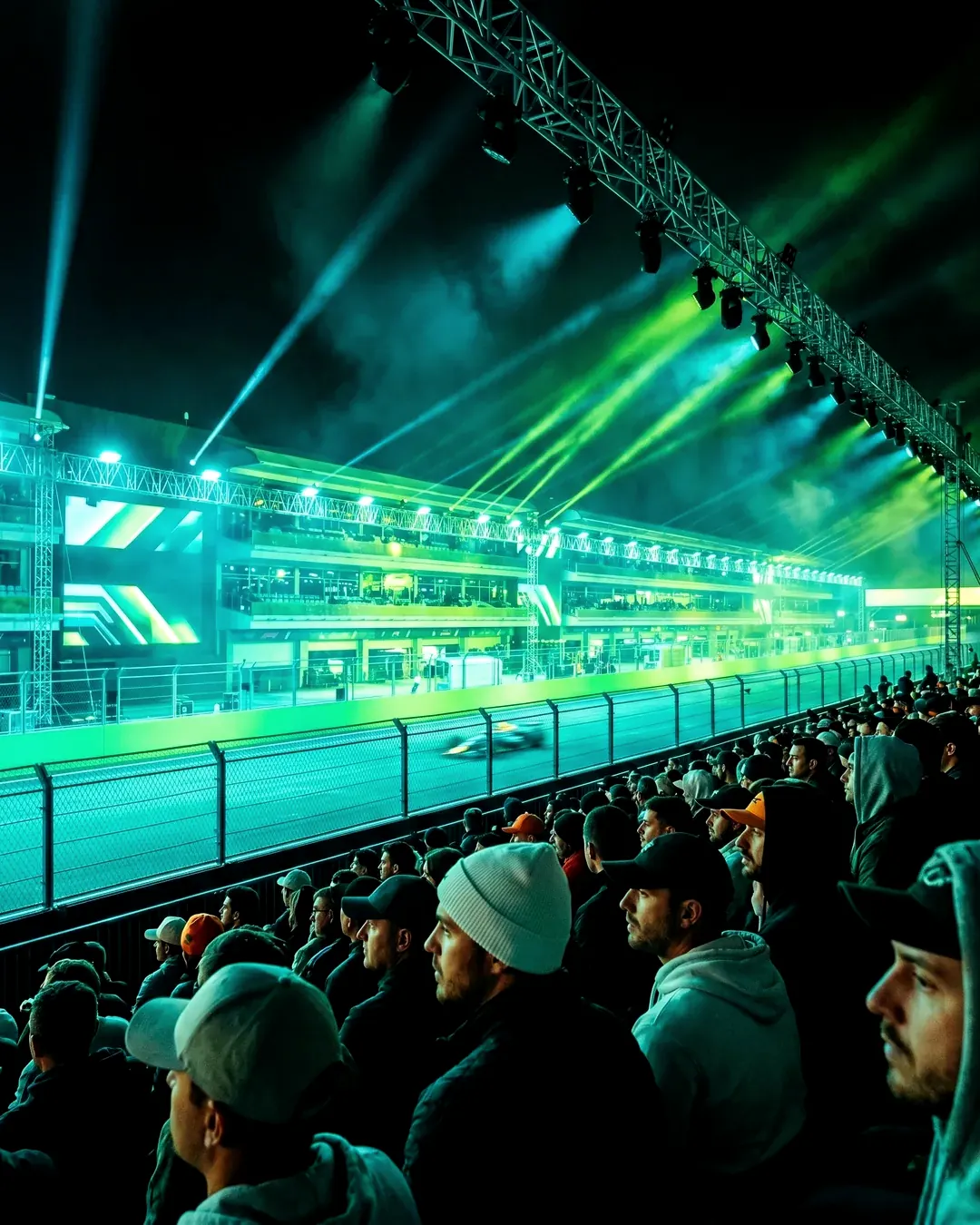 A vast crowd at a landmark event at night
